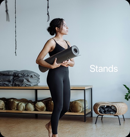 Woman carrying a yoga mat — count stands